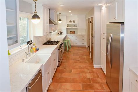 Countertops made from porcelain are supported by a long list of pros, and you can find them below along with the cons. White cabinets and white marble countertops contrast ...