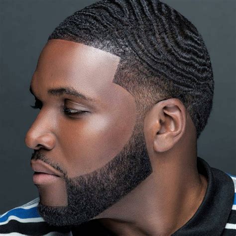 This cool cut for black hair extends the hairline into an arced part that also divides long hair from short. 30 Cool Black Men Haircuts 2016 | African American ...