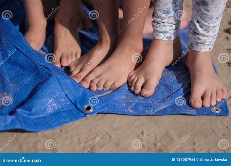 Children`s Bare Feet Child`s Bare Feet On The Cement Floor Royalty
