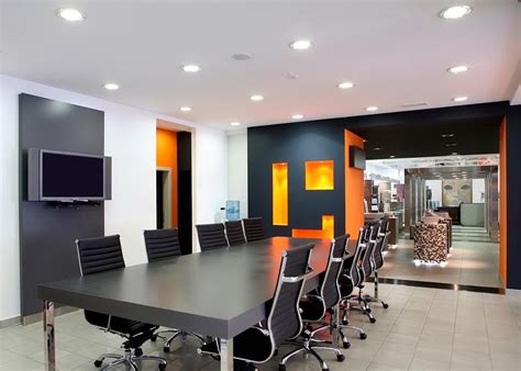 .living rooms, and dining rooms are often one large space, color is used to help define interiors and create focal points in relatively featureless rooms. Black White Orange Wall Color For Modern Office Meeting ...