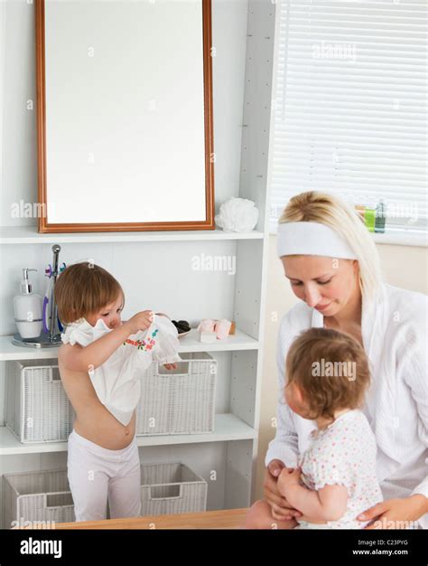 Mother Taking Care Of Her Children Stock Photo Alamy