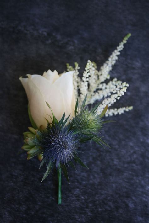 The wedding dress was traditionally black, passed on as heritage by the bride's mother. Button Hole for a Scottish Groom | Blue wedding flowers ...