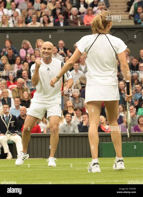 American Tennis Star Andre Agassi Celebrates Winning A Point During A