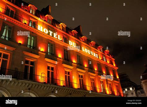 Illuminated Facade Of Hotel Du Louvre In Paris Located Next To Palais Royal And The Louvre
