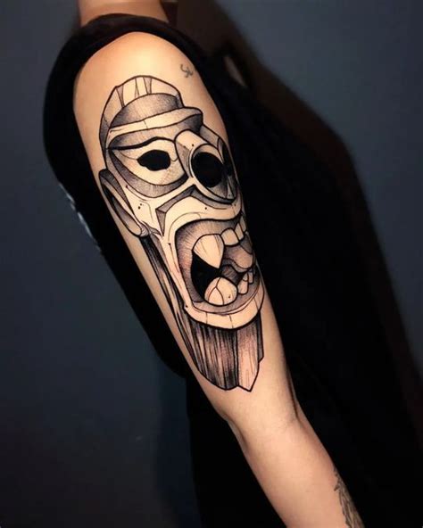 A Mans Arm With A Mask On It And His Face Drawn In Black Ink