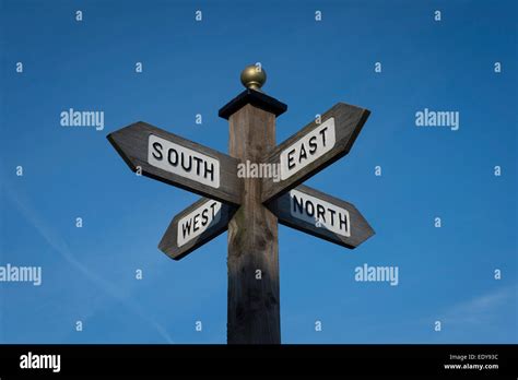 Signpost Showing Directions To The North South East And West Stock