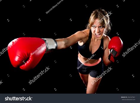 Young Sexy Angry Fighter Girl With Red Gloves Fighting