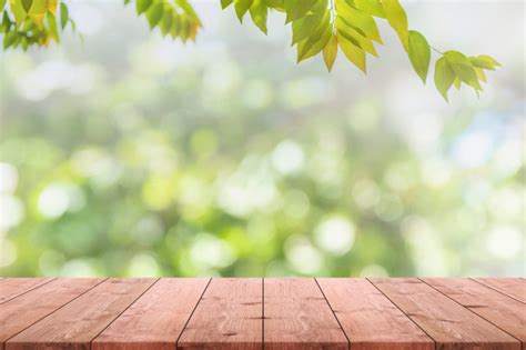 Empty Wood Table Top And Blurred View From Green Tree Garden Bokeh