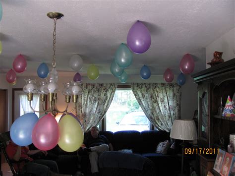 Replicate this design with a single knot pattern featuring tassels at the bottom. Live, Learn, Love: Simple Birthday Decorations