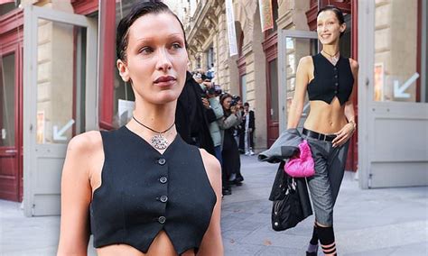 bella hadid shows off her toned physique in a cropped waist coat as she steps out during pfw