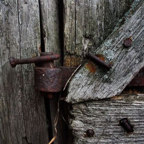 An Old Rusty Lock On A Wooden Door