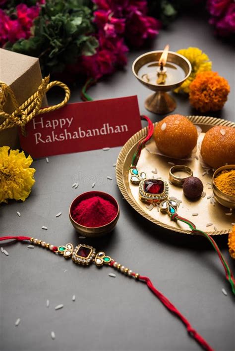 Indian Festival Raksha Bandhan With Rakhi Bracelets Presents Rice And Kumkum And Sweets In
