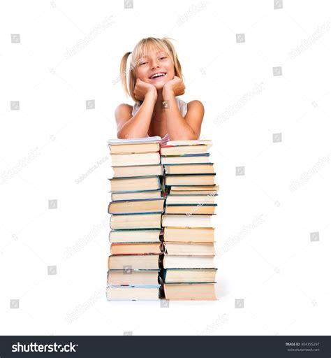 Back To School Happy Smiling Schoolgirl Sitting On Stack Of Books