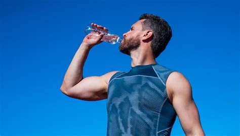 Premium Photo Athletic Man Drinking Water Because Of Thirst After