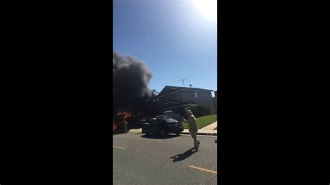Trash Truck Engulfed In Flames Rolls Through A Residential Area In
