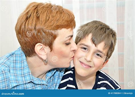 Mother Kissing Her Son Stock Photo Image Of Caucasian