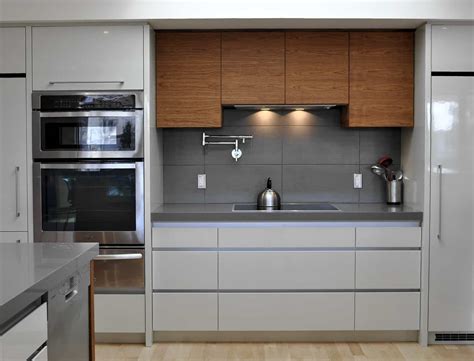 Kitchen Appliances Are Arranged Along One Wall To Maximize Efficiency