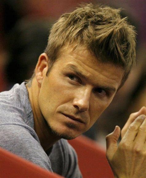A guy with long hair that was finally incorporated into a bun at the back looks absolutely badass. David Beckham Fauxhawk Haircut - Hairstyles Weekly