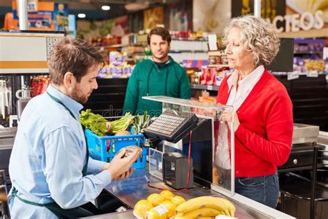 Cashier And Customer At Checkout In The Supermarket Stock Photo Image