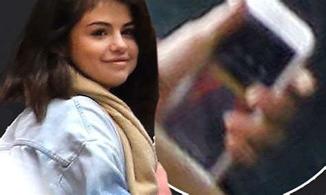 Selena Gomez Smiles As She Listens To The Weeknds Album Daily Mail