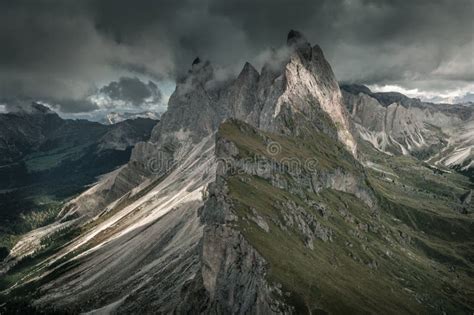 Dramatic Mountain Peaks Of Seceda With Clouds In The European Dolomite