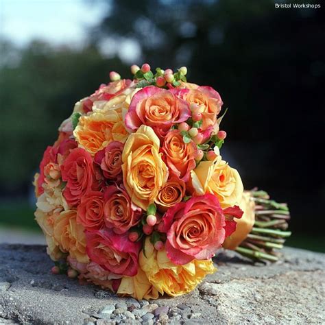Pink and orange wedding bouquets. Bouquet Idea: Shades of Pink + Orange Roses with Hypericum ...