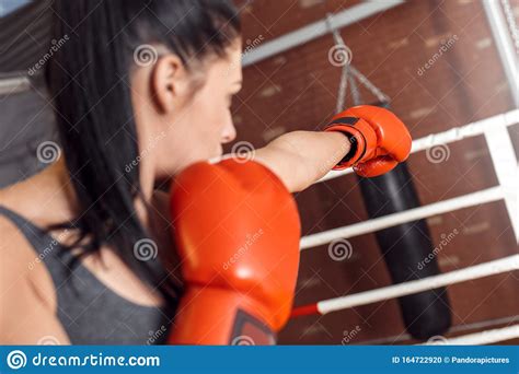 Boxing Woman Boxer In Gloves Practising Kick On Ring Back View Stock