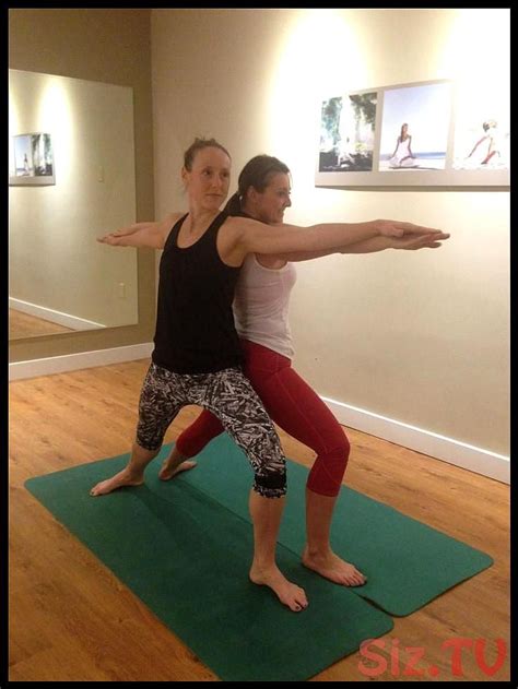 Partner a sits with legs crossed and brings hands behind hips opening up the heart. Learn how to teach this nine-pose partner sequence in a ...