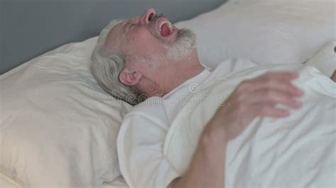 Old Man Waking Up From Nightmare In Bed Stock Footage Video Of Tired