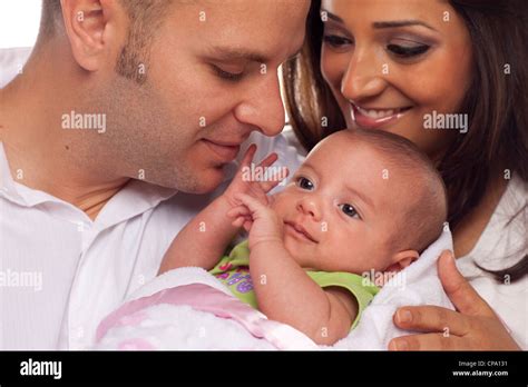 Happy Young Attractive Mixed Race Couple With Newborn Baby Stock Photo