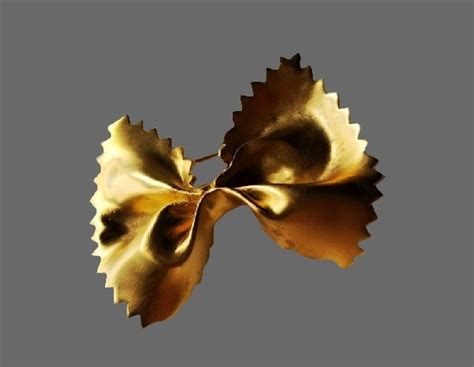 Bow Brooch Of Gold Tone Kaleidoscope Effect