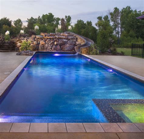 Beautiful Modern Pool With Led Features Spill Over Spa And A Custom Rock Waterfall With A