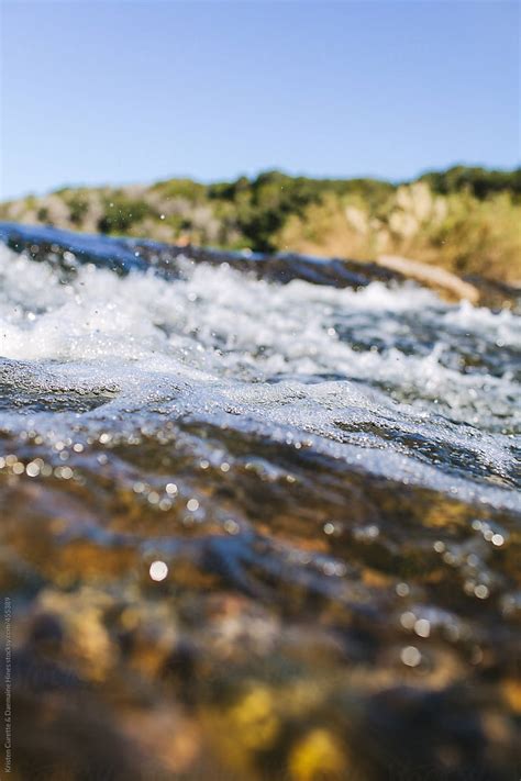 River Stream Flowing Over Mossy Rocks By Stocksy Contributor Kristen