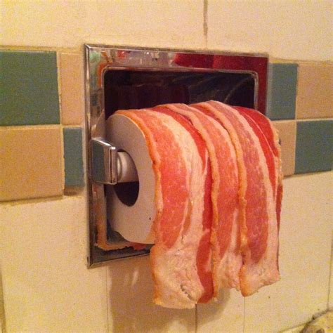 A Bunch Of Bacon Hanging From A Toaster Oven