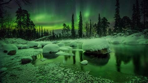 Beautiful Aurora Borealis Northern Lights Snow Covered Stones Trees
