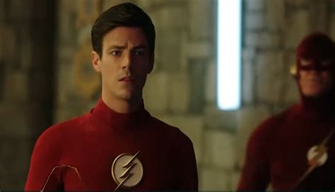 The Flash Standing Next To Another Man In A Red Suit With His Hands On