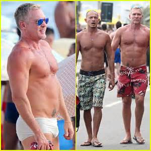 Sam Champion Strips Off Board Shorts To Show Sexy Speedo Rubem Robierb Sam Champion