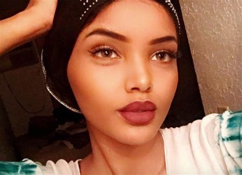 hijab wearing model signs with img