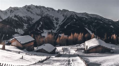 Download Wallpaper 1366x768 Mountains Village Winter