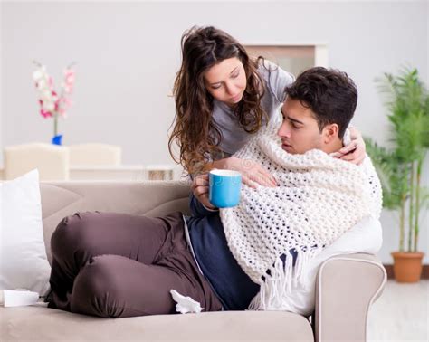 Wife Caring For Sick Husband At Home Stock Photo Image Of Drinking