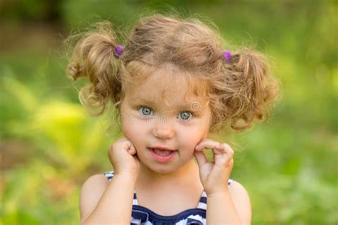 Cute Little Girl With Curly Blond Hair Stock Image Image Of Grass