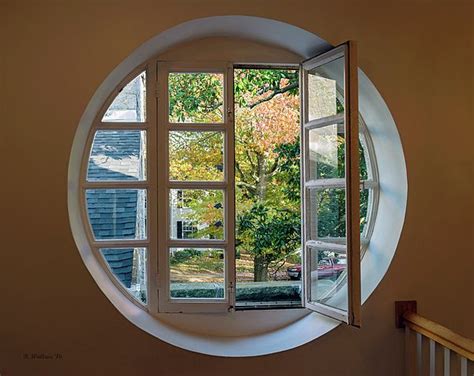 An Image Of An Upstairs Round Window Opening At A Gallery In Easton