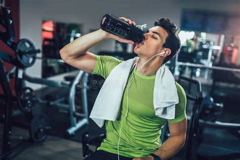 Sporty Man Resting Having Break Drinking Water After Doing Exercise
