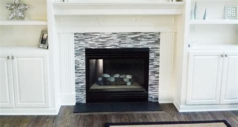 This gas fireplace surround consists of marble subway tiles and a simple yet elegant fireplace mantle. Blog Articles