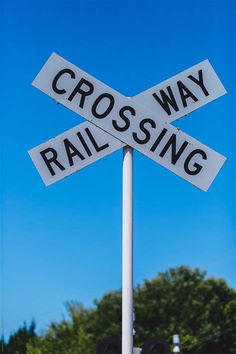 Railway Crossing Sign By Stocksy Contributor Ohlamour Studio Stocksy