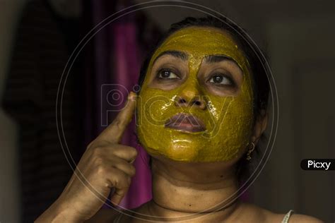 Image Of Close Up Of A Woman With Cosmetic Facial Mask All Over Her Face Ym233557 Picxy