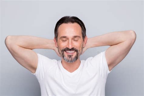 Photo Of Handsome Mature Man Guy Holding Hands Behind Head Peaceful