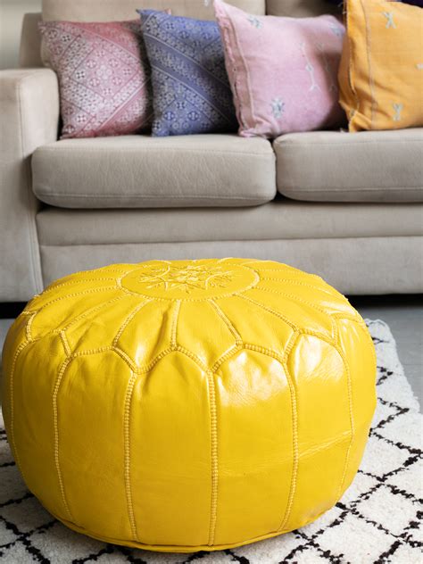 Amelia upholstered storage ottoman this upholstered storage ottoman has got tufted cushion, large storage, many color options to choose and chrome nailhead trims. Yellow Leather Ottomans - KOUTCHI