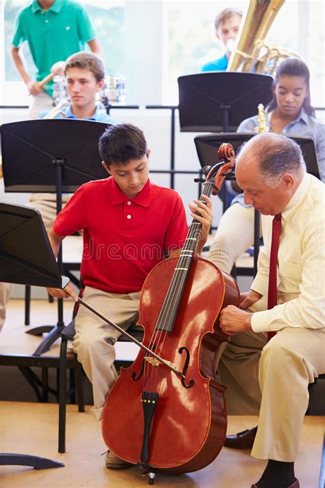 Boy Learning To Play Cello In High School Orchestra Stock Photo Image
