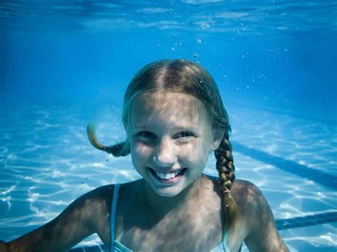 Girl Swimming Underwater In Pool Superstock
